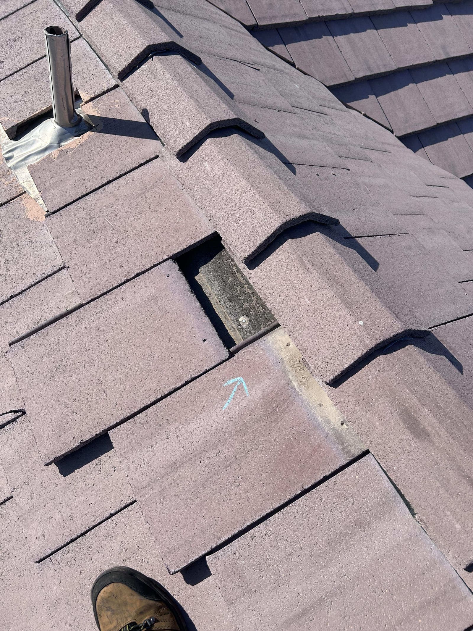 Broken roof tile marked for repair on a Las Vegas home